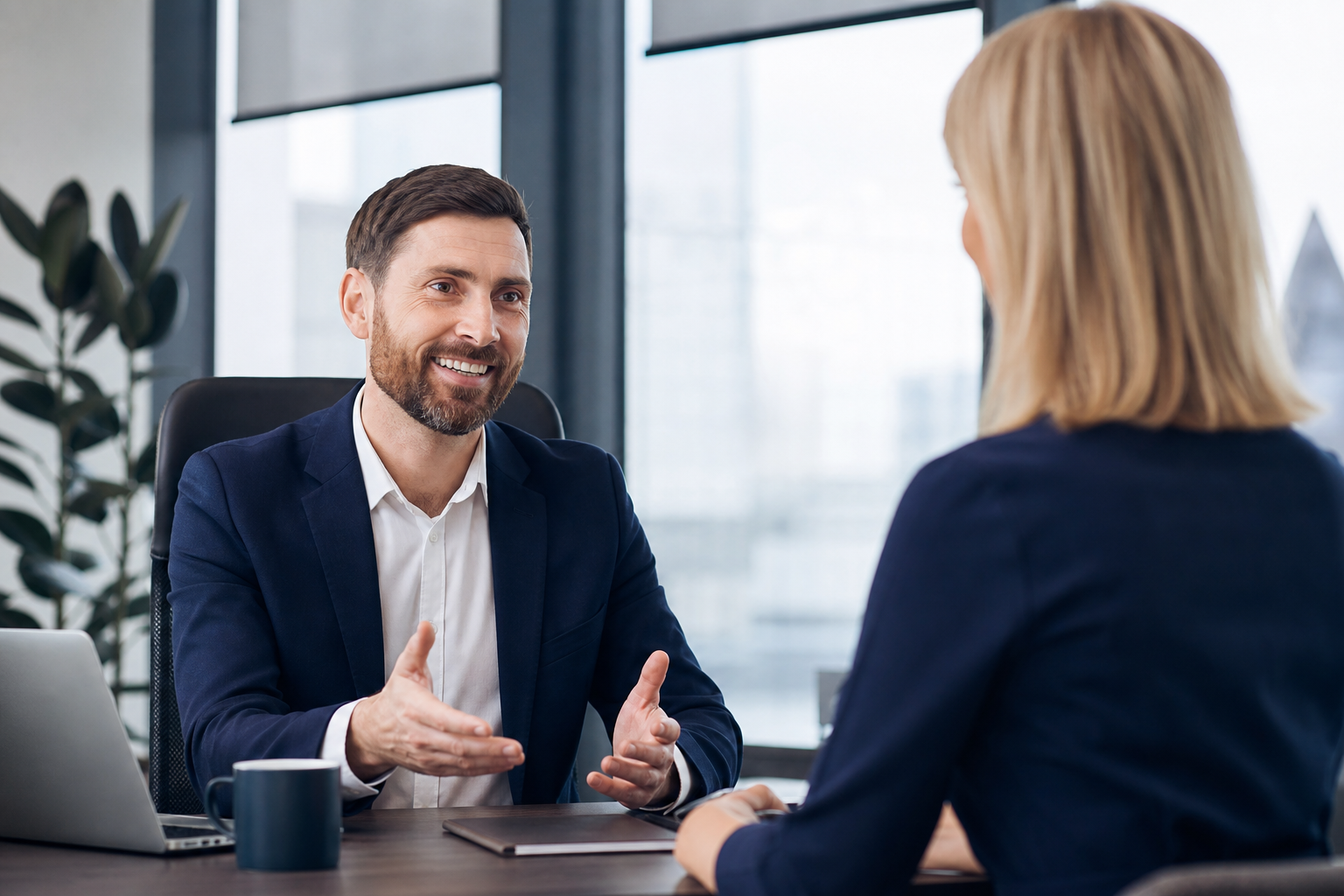 Insurance advisor meeting with a client in a modern office